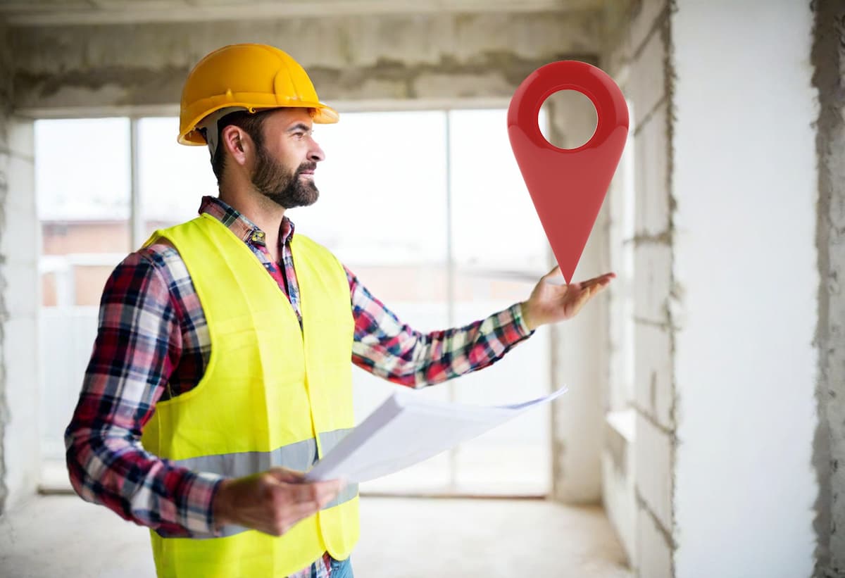 Contractor holding a Google Map Pin